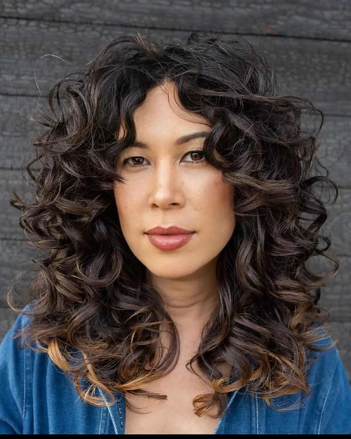 26 Best Ways to Get Curtain Bangs for Curly Hair Right Now