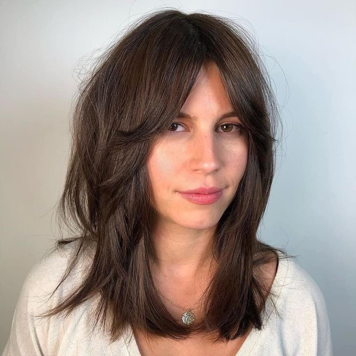 26 Best Ways to Wear Curtain Bangs for Straight Hair, According to Stylists