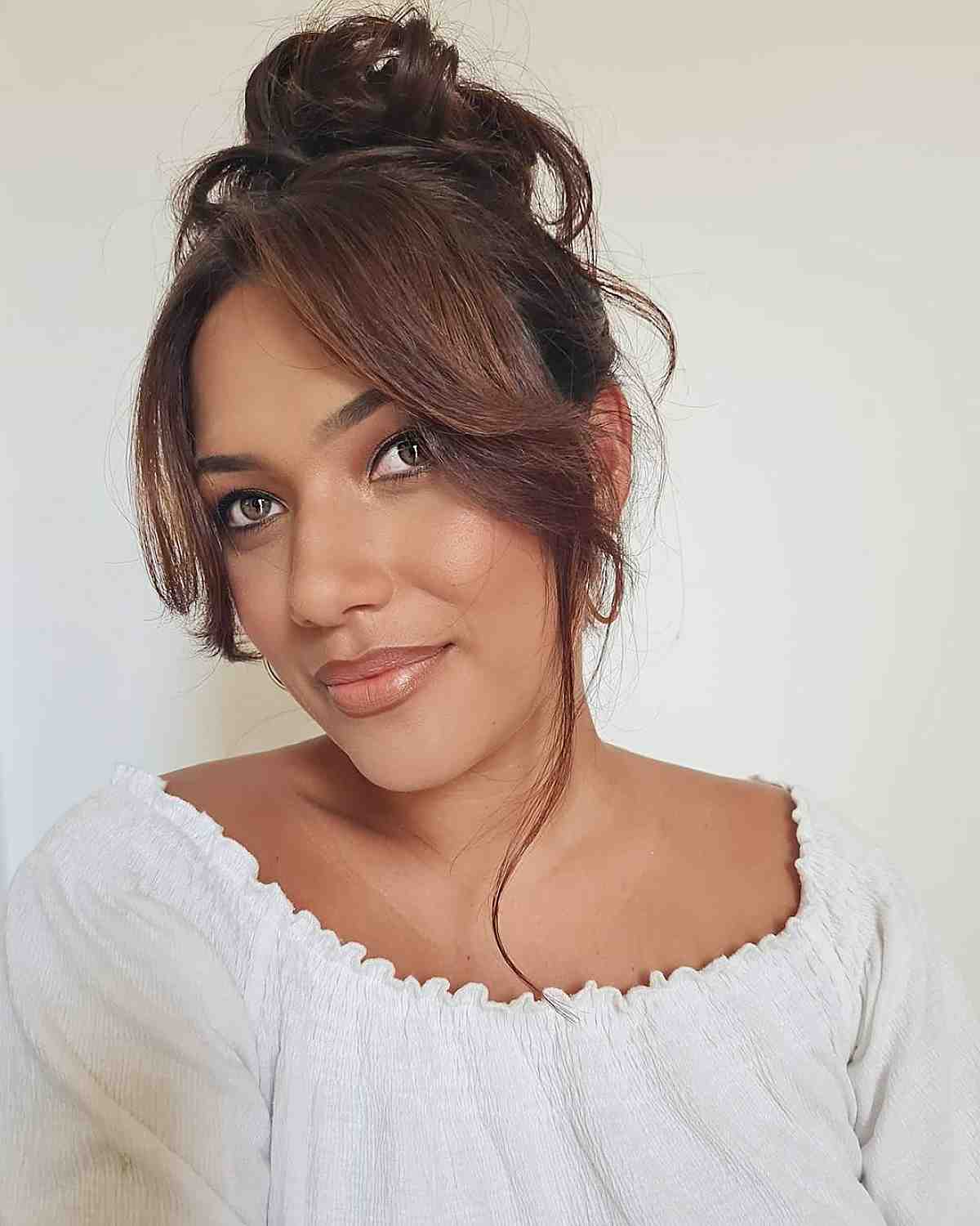 26 Best Ways to Wear Curtain Bangs for Straight Hair, According to Stylists