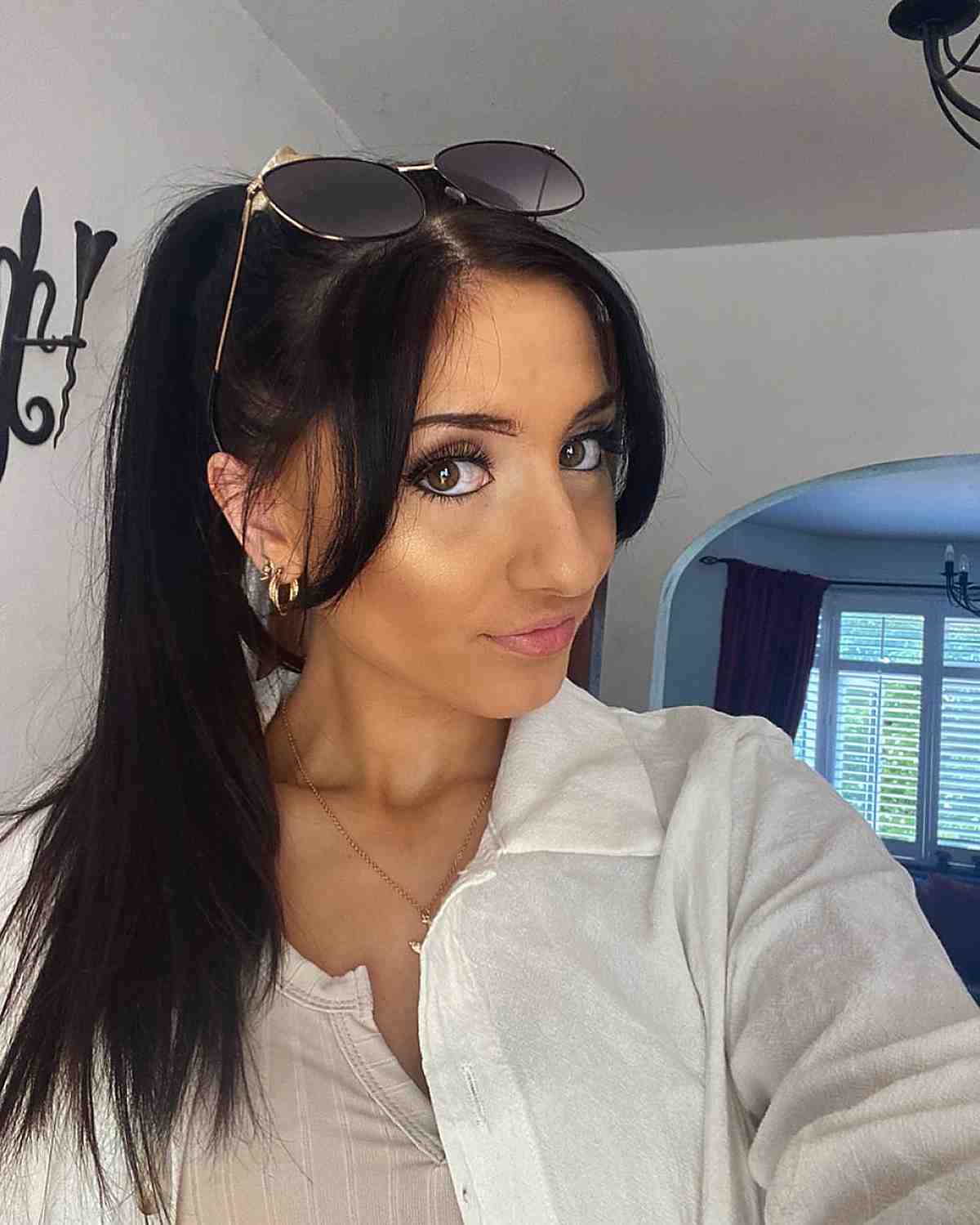 26 Best Ways to Wear Curtain Bangs for Straight Hair, According to Stylists