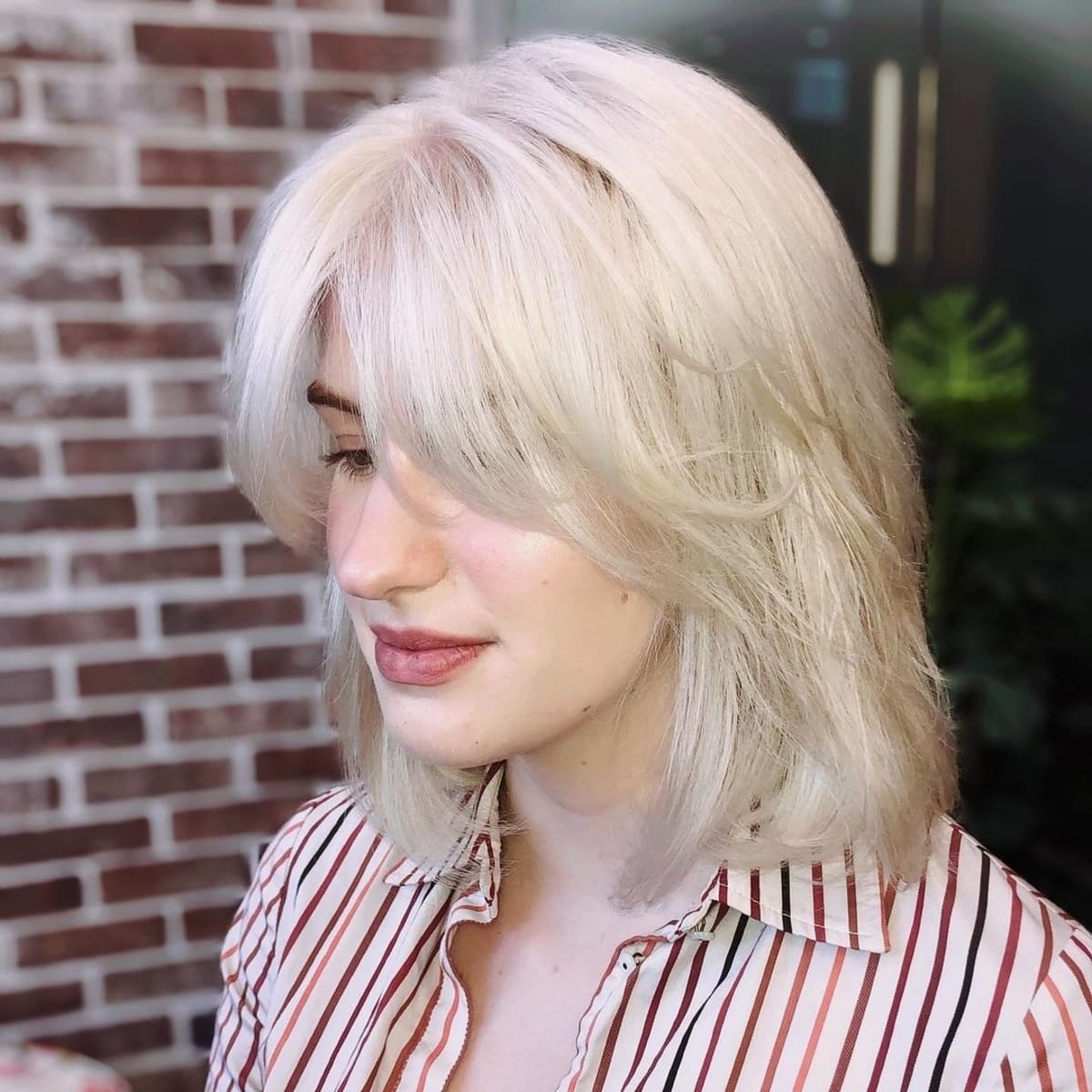 26 Best Ways to Wear Curtain Bangs for Straight Hair, According to Stylists