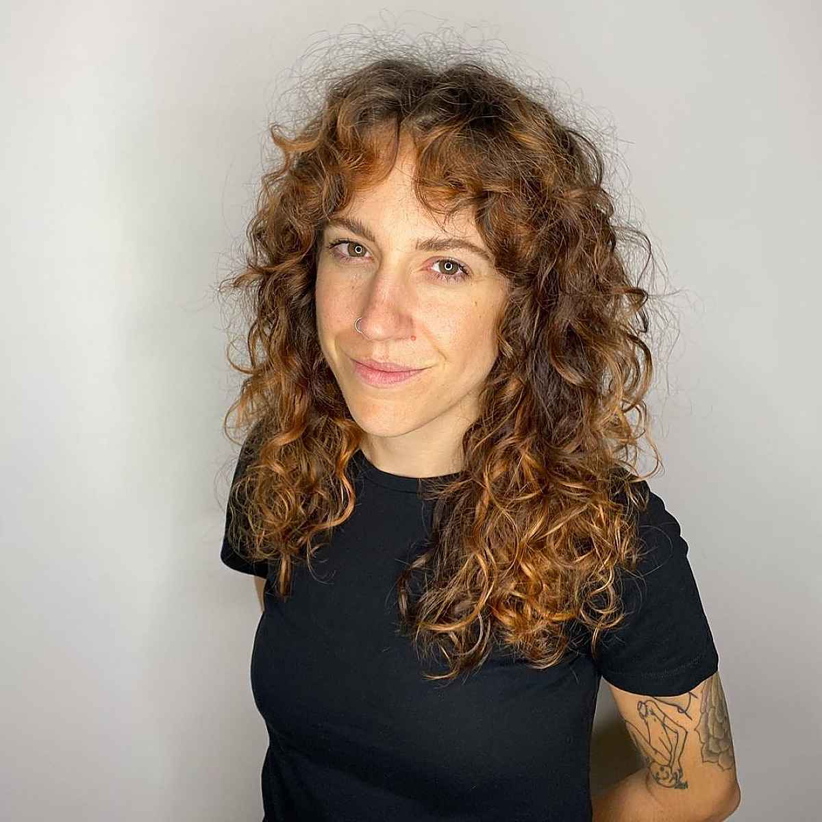 21 Best Ways to Get Curtain Bangs for Curly Hair Right Now