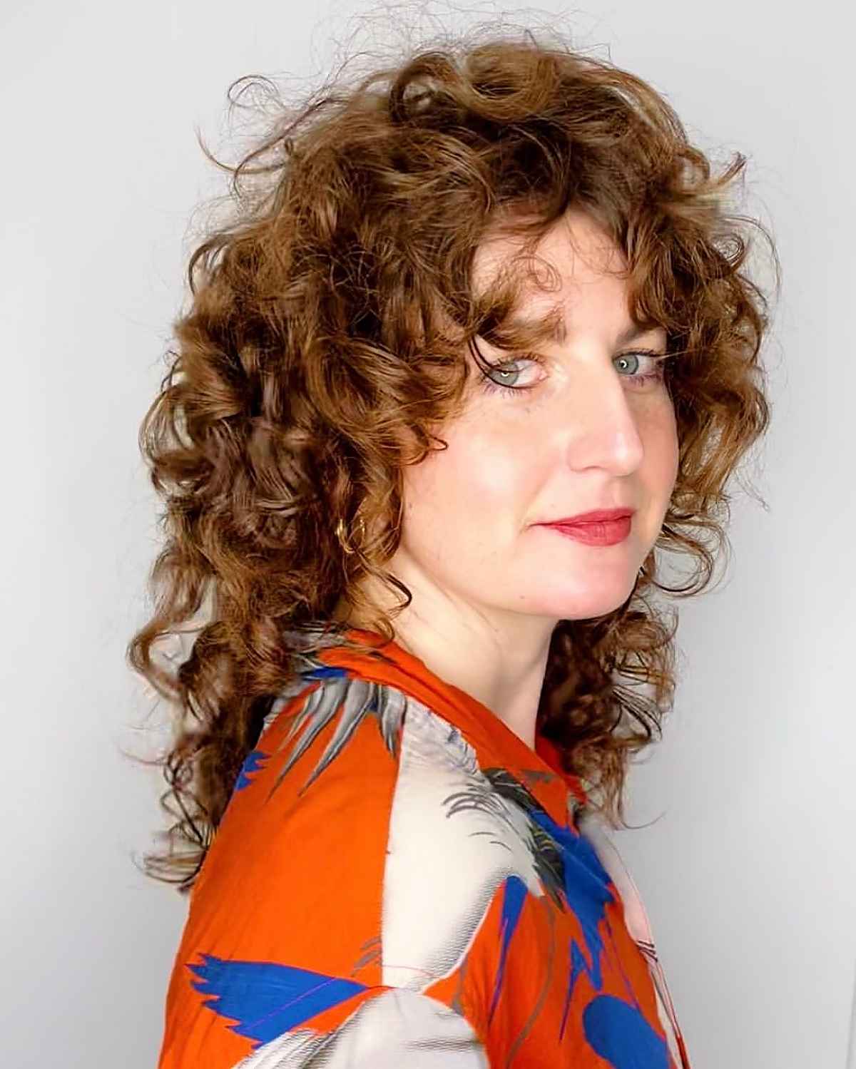 21 Best Ways to Get Curtain Bangs for Curly Hair Right Now