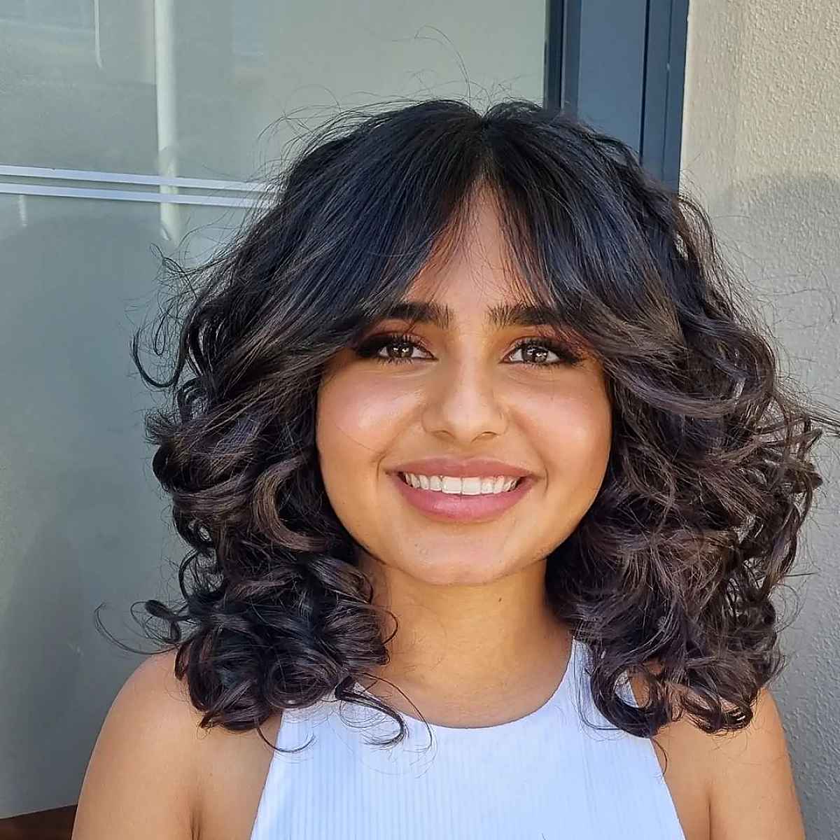 21 Best Ways to Get Curtain Bangs for Curly Hair Right Now