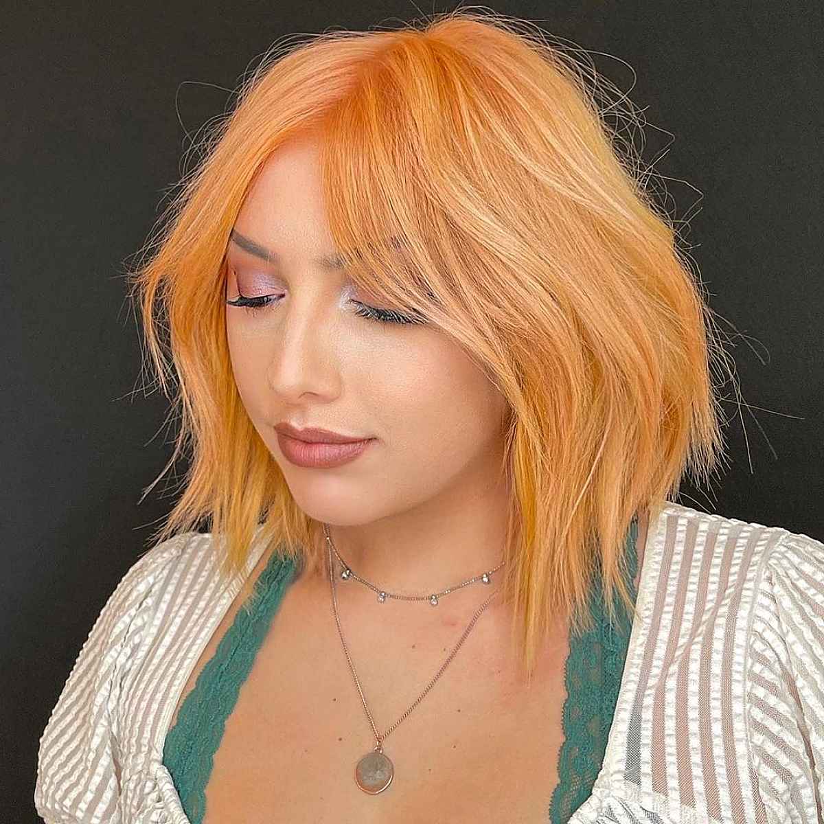26 Slimming Hairstyles for Women with Full Faces (for Plus-Sized Women)
