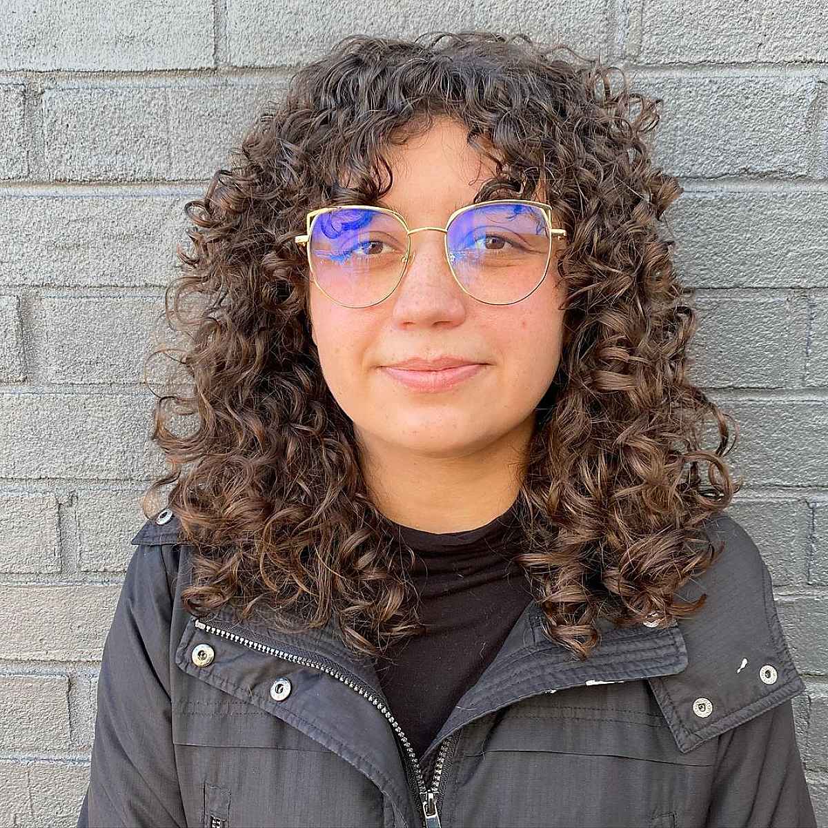 21 Best Ways to Get Curtain Bangs for Curly Hair Right Now
