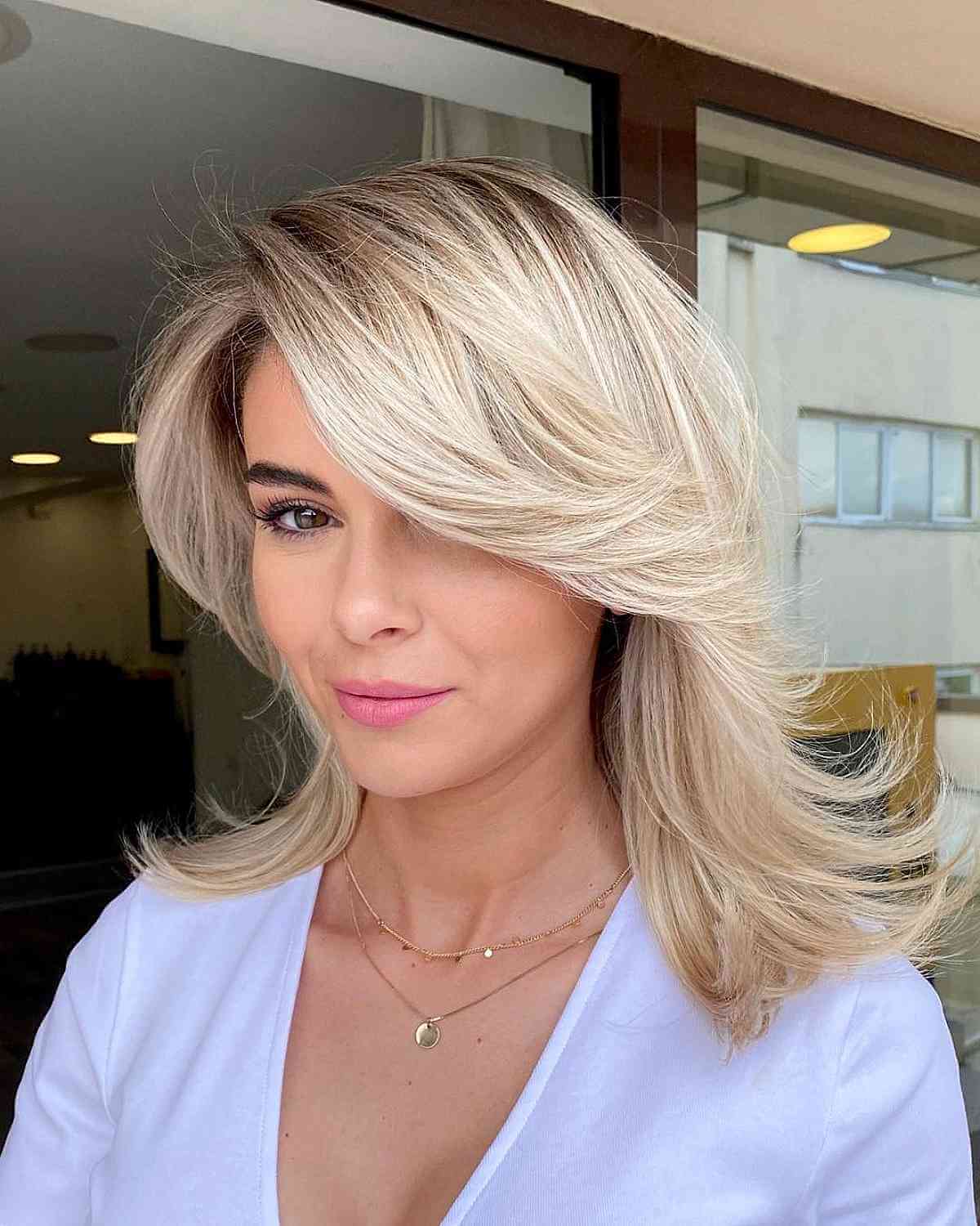 22 Medium Layered Haircuts with Side Bangs for a Chic Combination