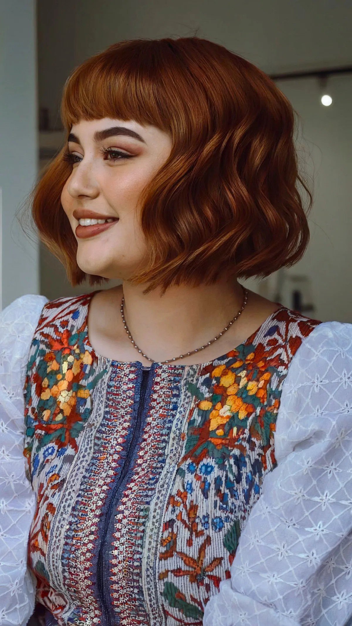 27 Flattering Bob Cuts with Bangs for Women with Round Faces