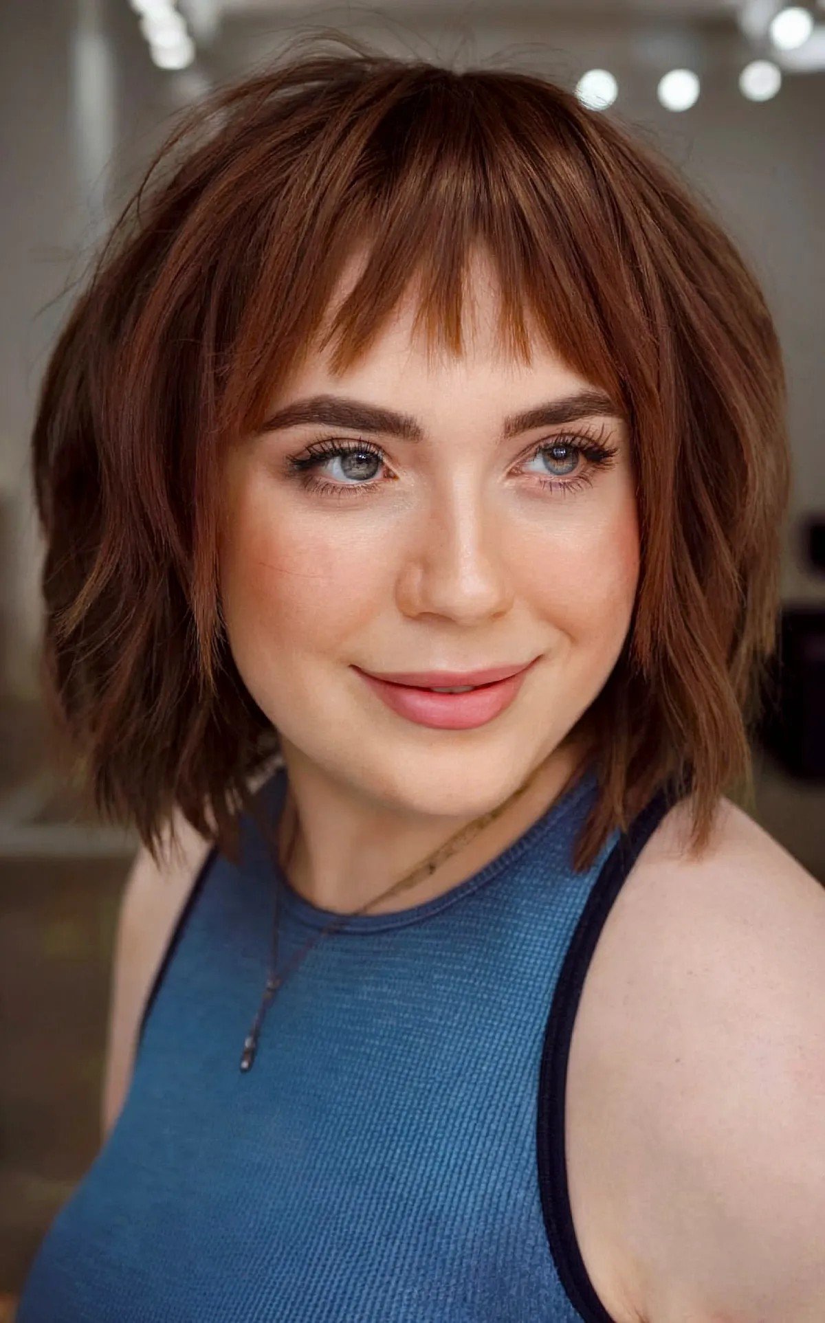 27 Flattering Bob Cuts with Bangs for Women with Round Faces