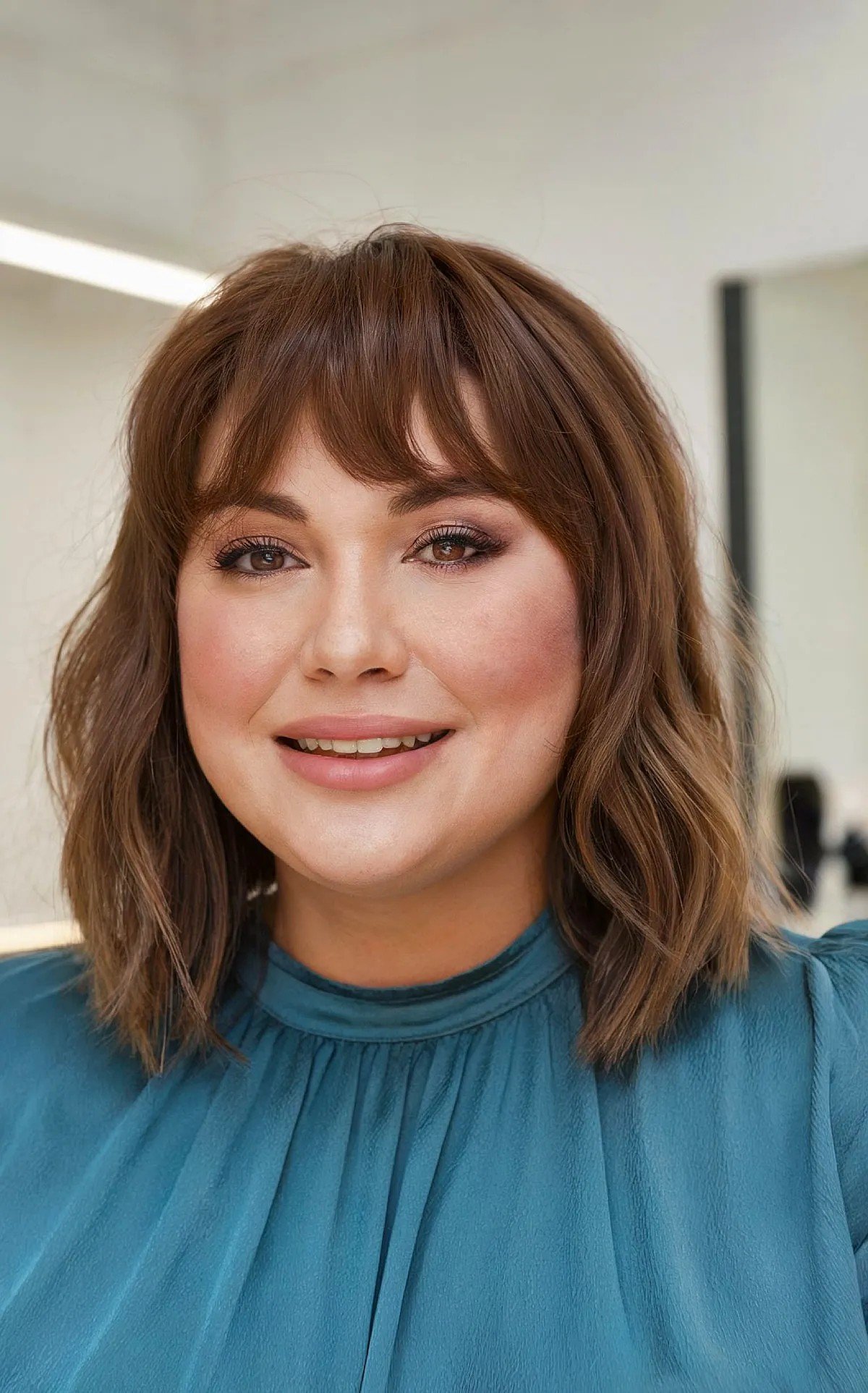 27 Flattering Bob Cuts with Bangs for Women with Round Faces