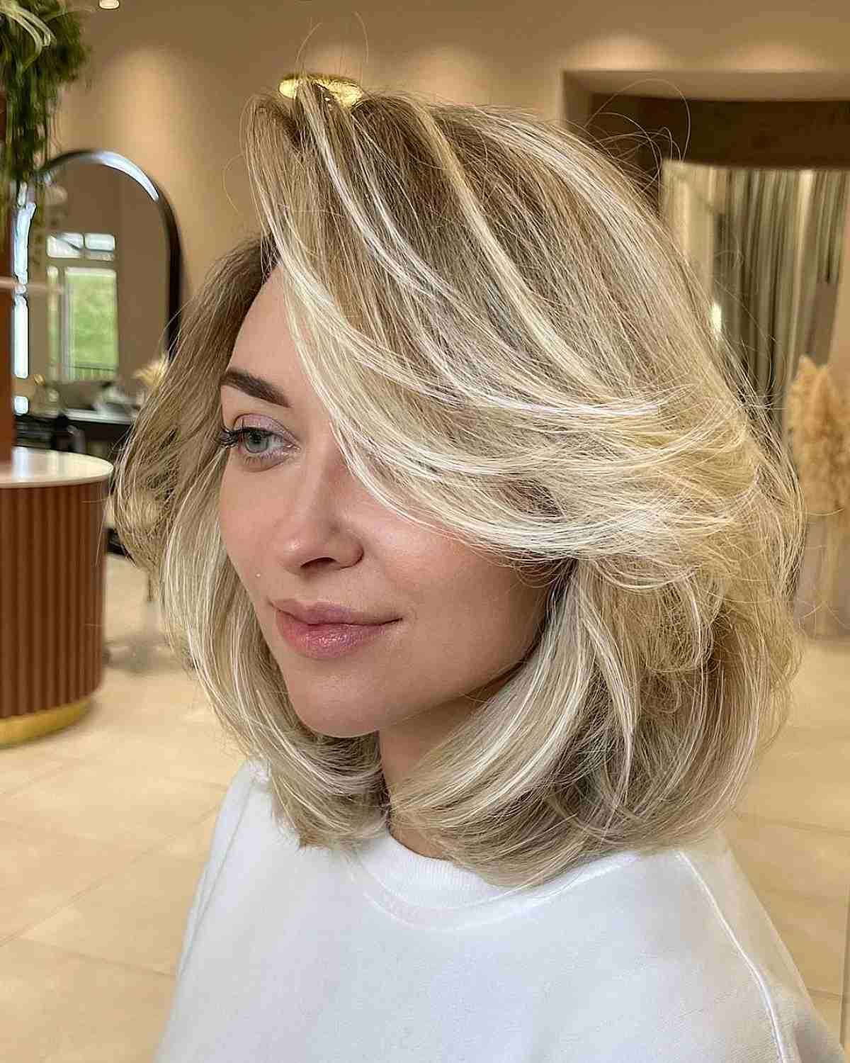 29 Feathered Bob Haircuts That Add Fullness & Movement to Your Hair