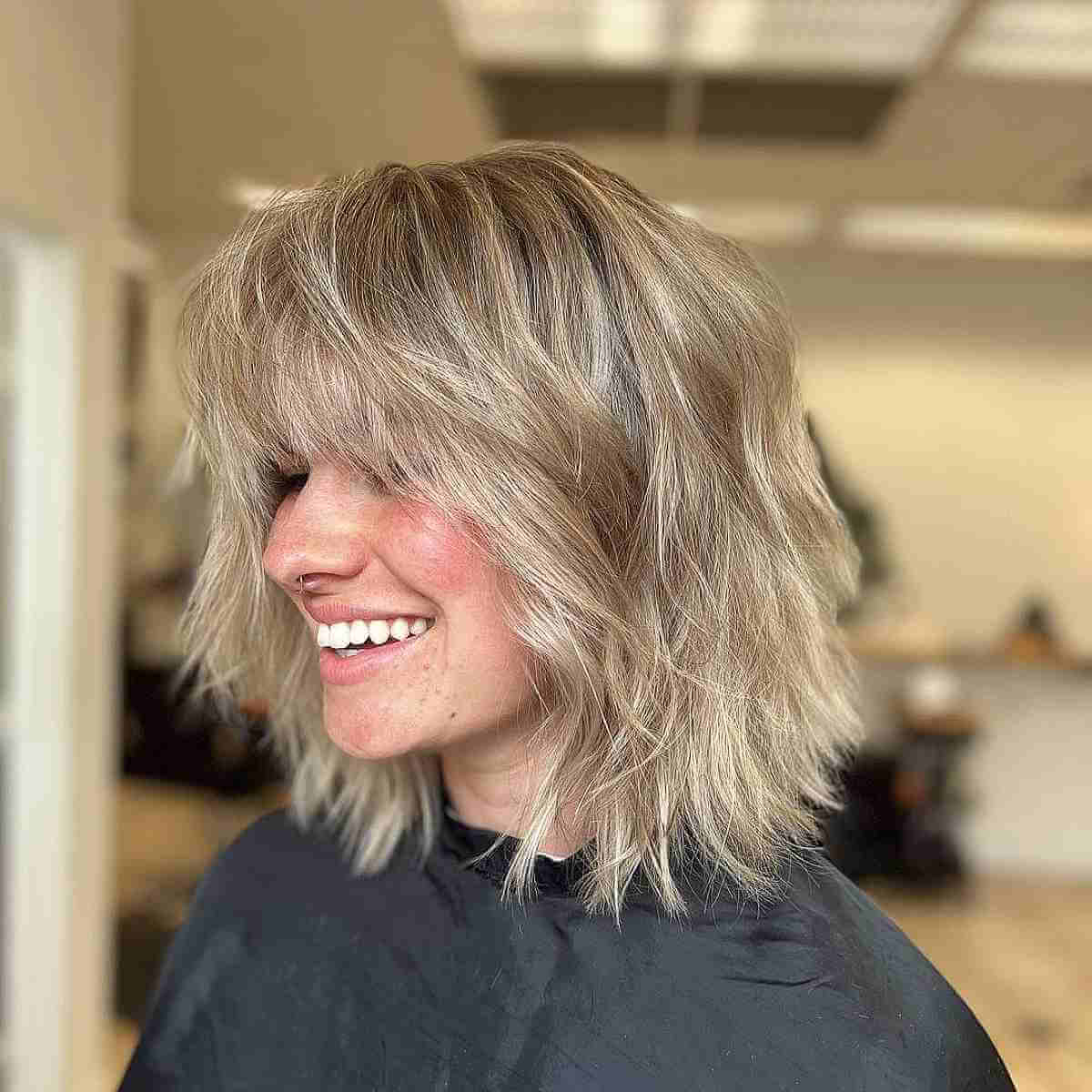 27 Cutest Wavy Bobs with Bangs Women Are Getting Right Now