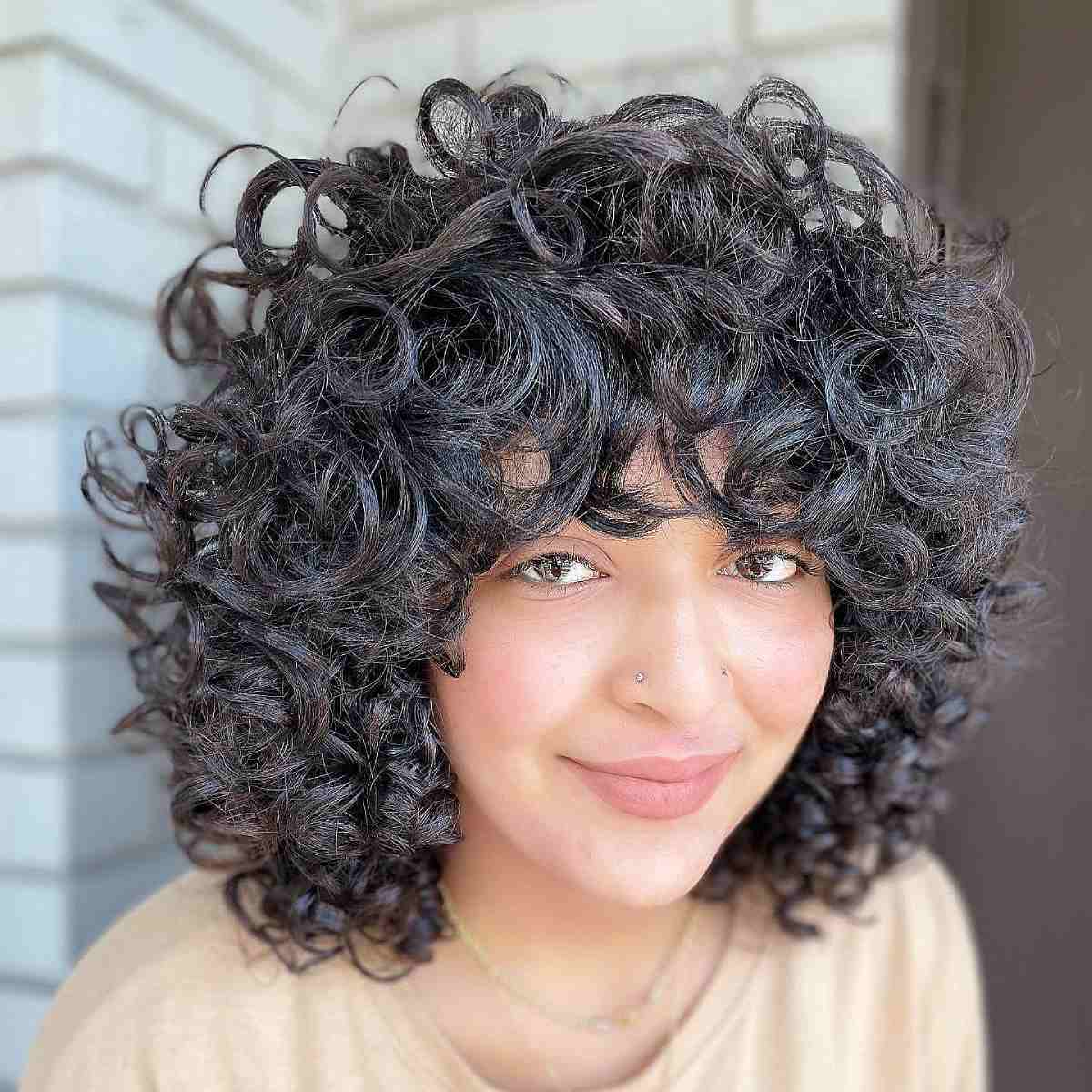 28 Best Curly Bob with Bangs for the Most Flattering Haircut & Hairstyle