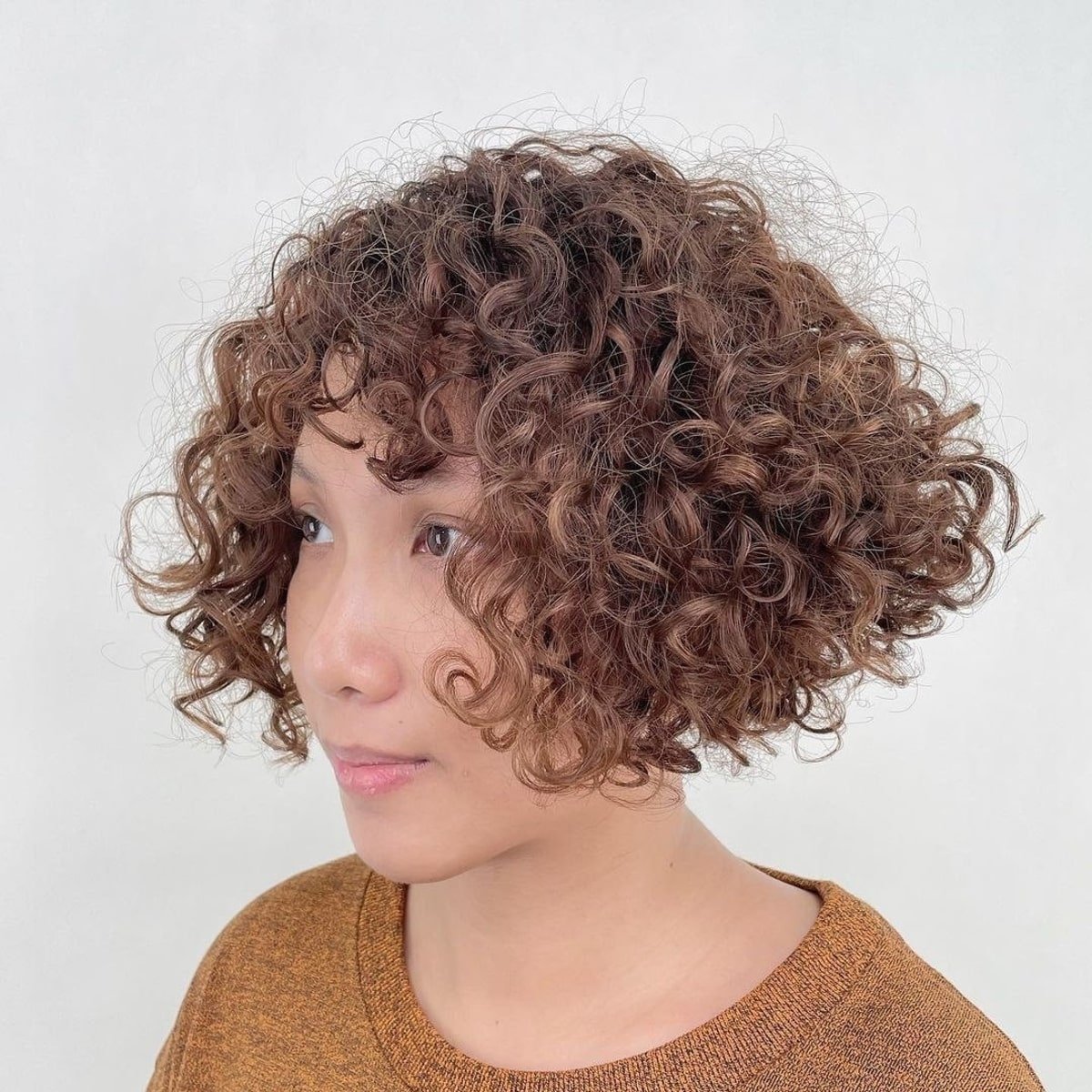 28 Best Curly Bob with Bangs for the Most Flattering Haircut & Hairstyle