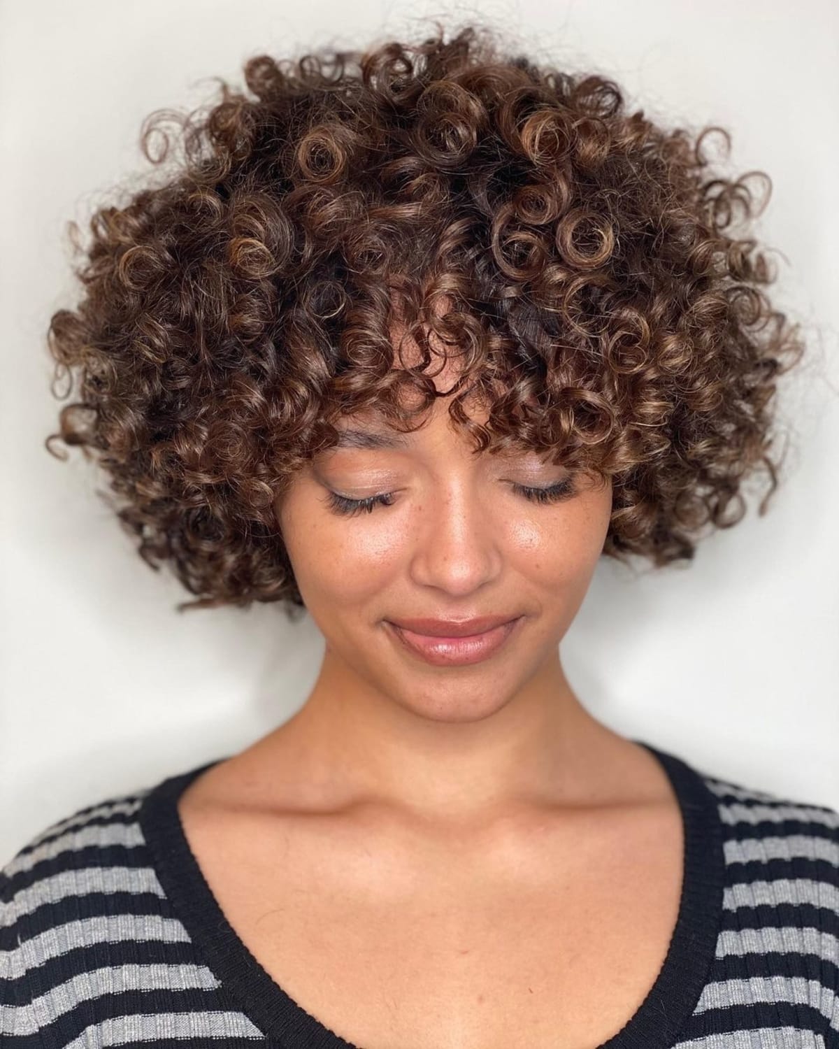 28 Best Curly Bob with Bangs for the Most Flattering Haircut & Hairstyle