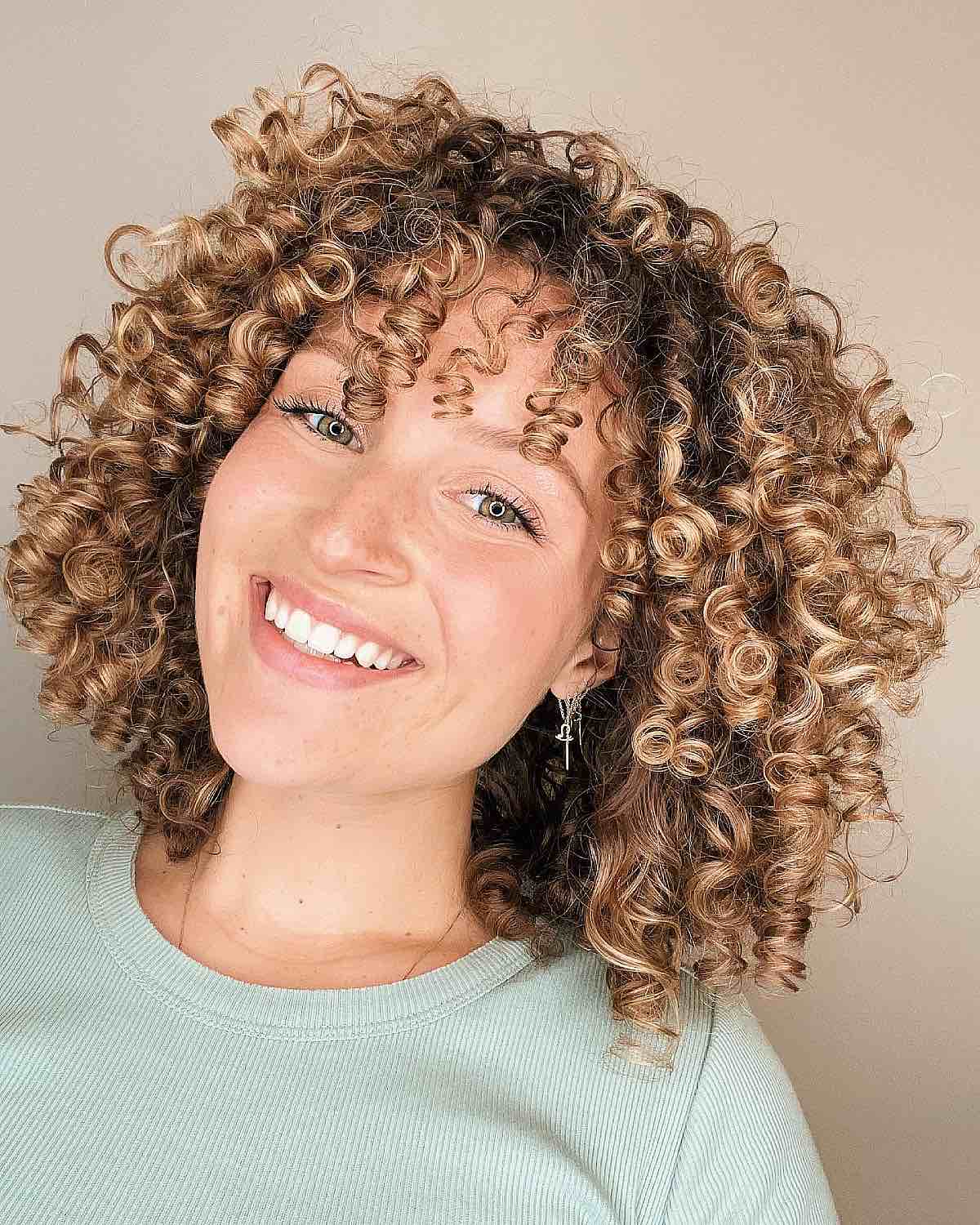 28 Best Curly Bob with Bangs for the Most Flattering Haircut & Hairstyle