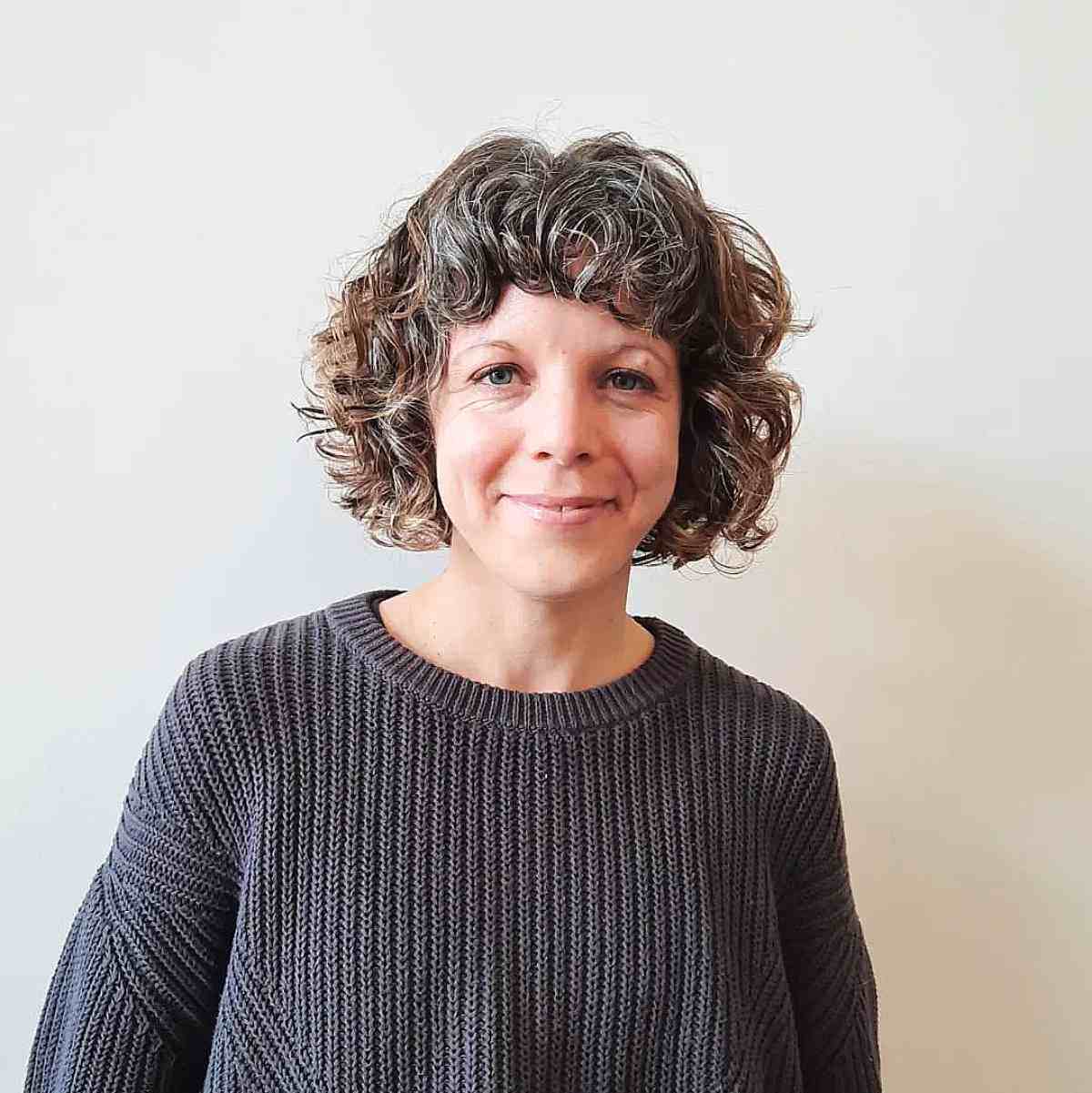 25 Gender Neutral Haircuts and Hairstyles for 2025