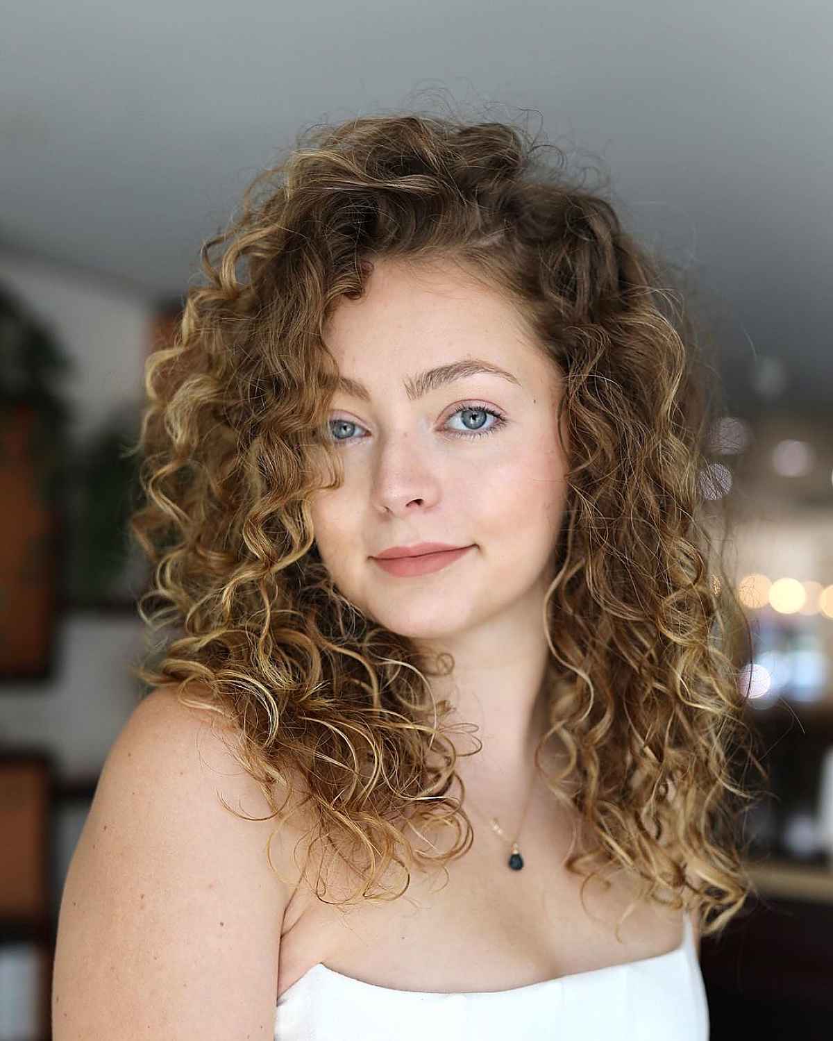 The Best Shoulder-Length Curly Hair Cuts & Styles in 2025