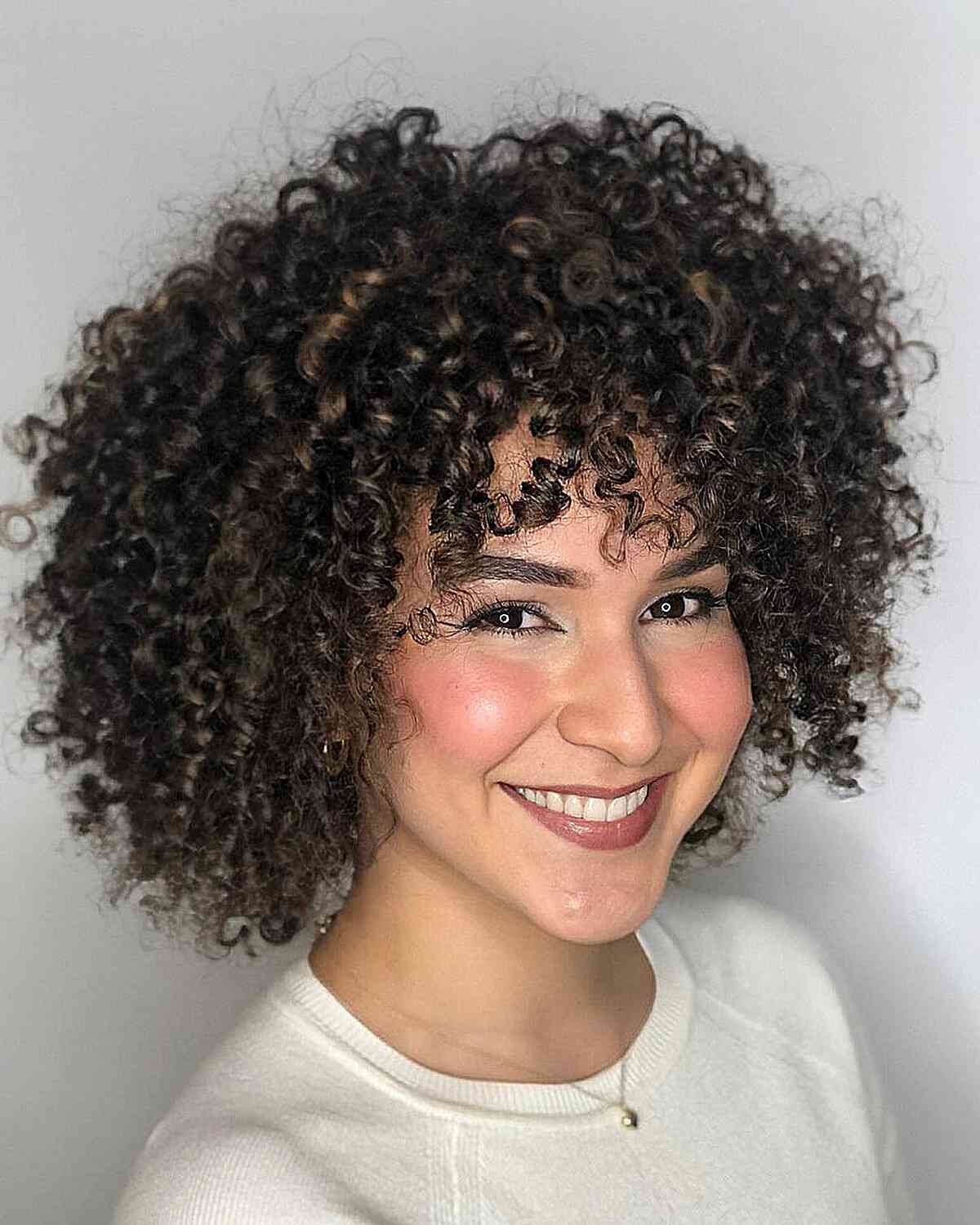 47 Best Short Curly Hair with Bangs to Try This Year