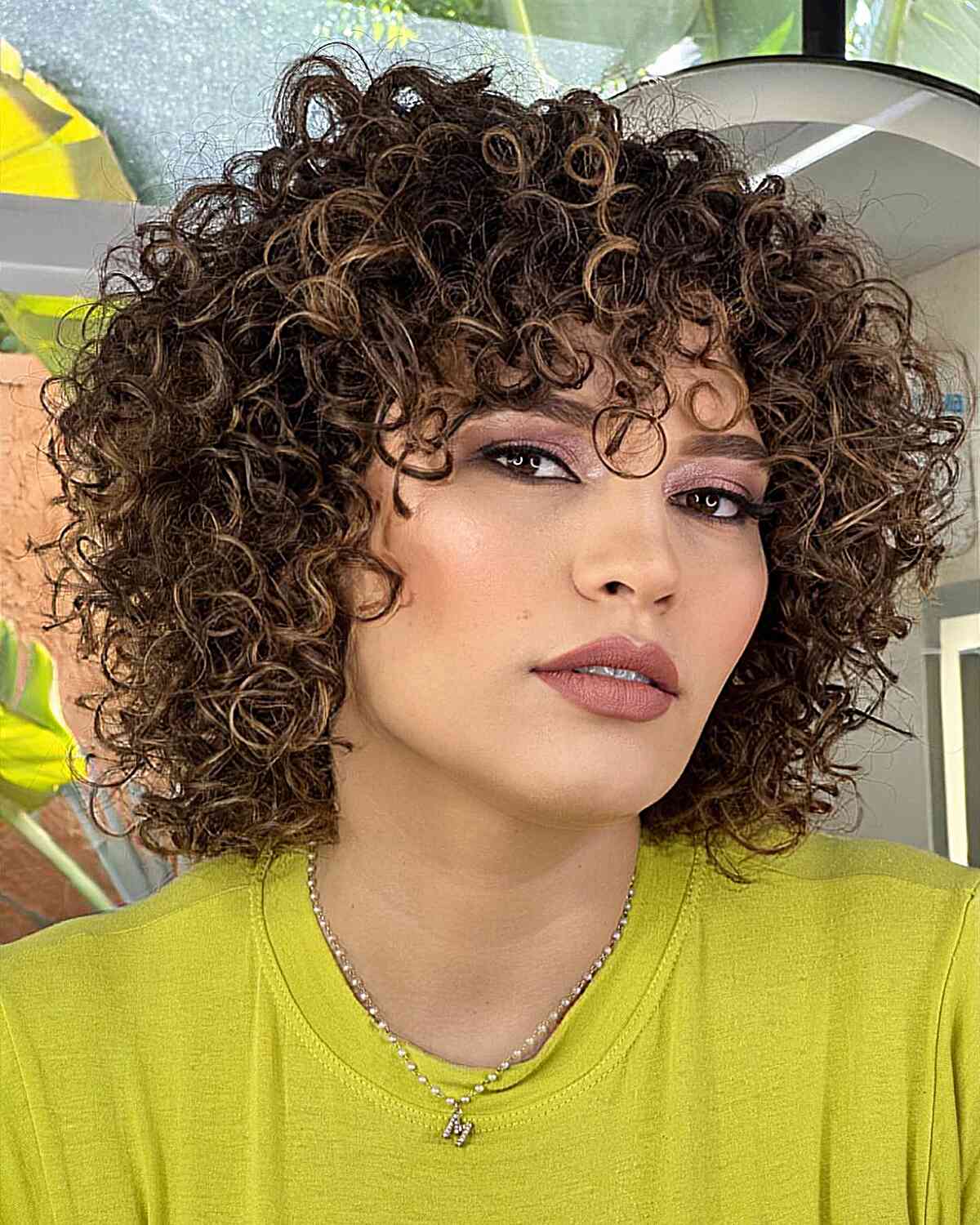 47 Best Short Curly Hair with Bangs to Try This Year