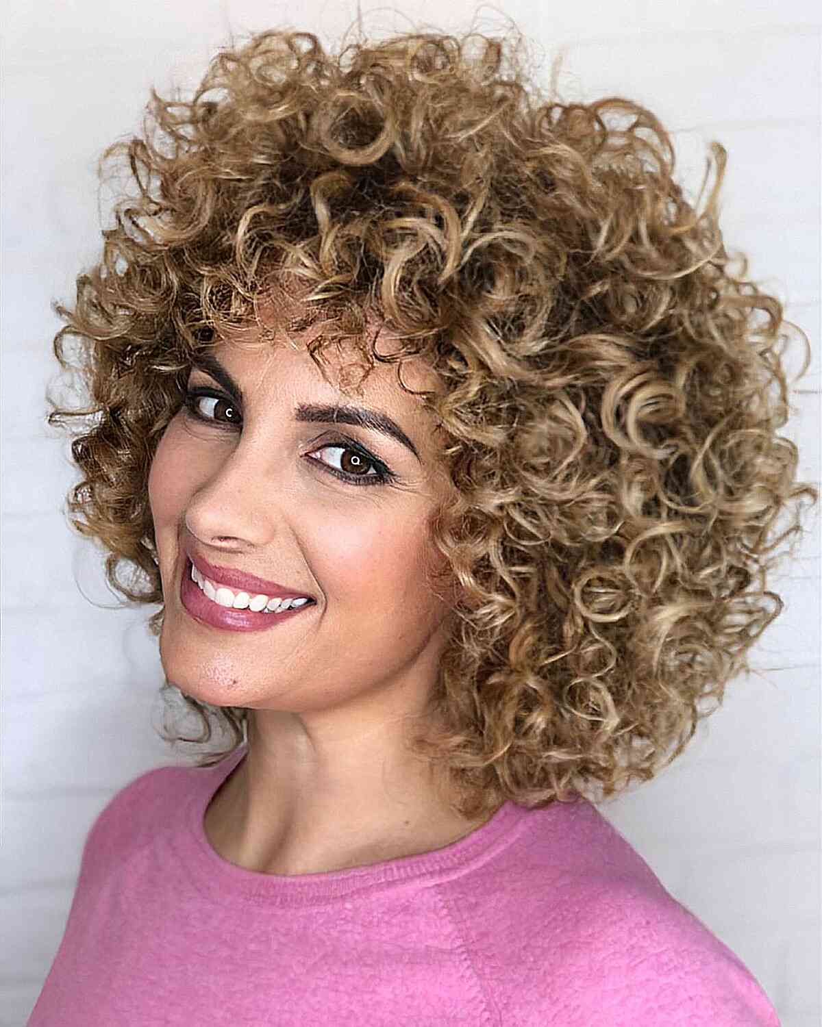 47 Best Short Curly Hair with Bangs to Try This Year