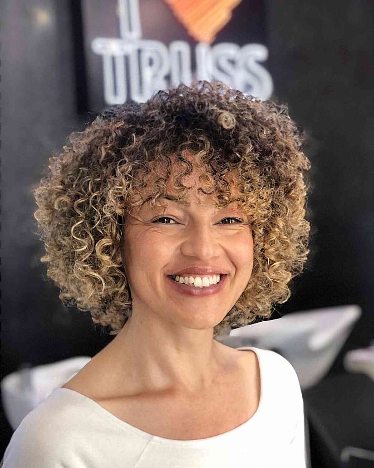 47 Best Short Curly Hair with Bangs to Try This Year
