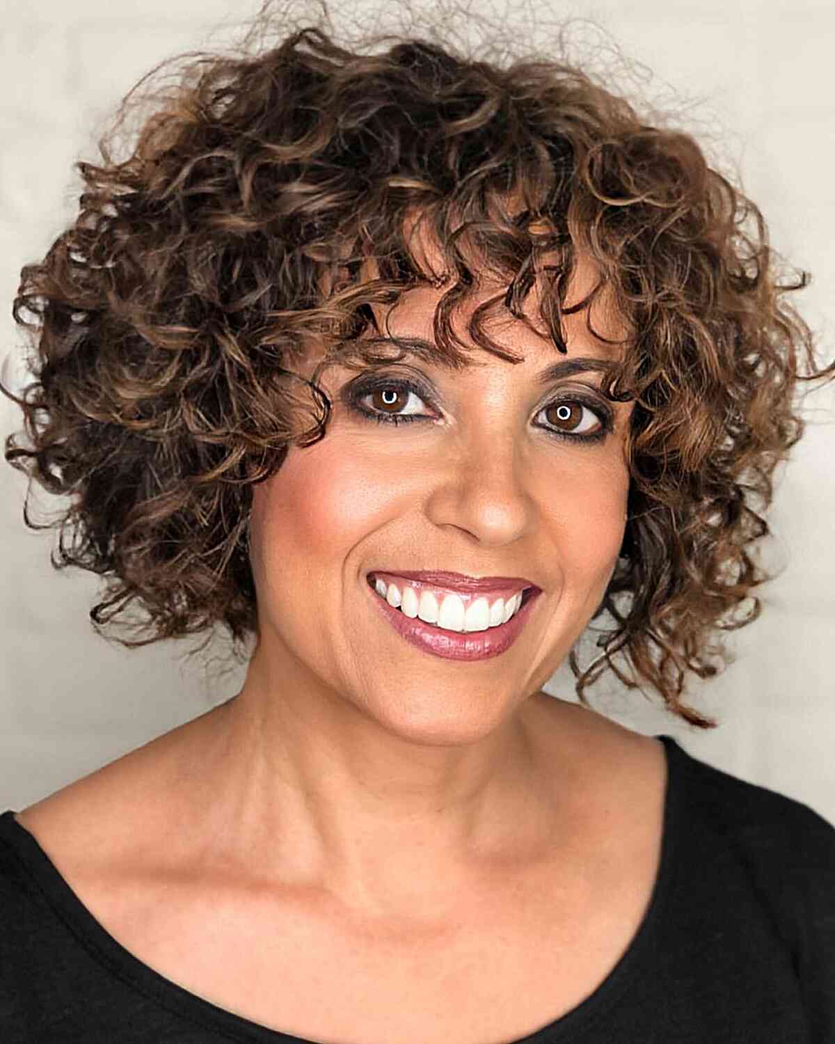 47 Best Short Curly Hair with Bangs to Try This Year