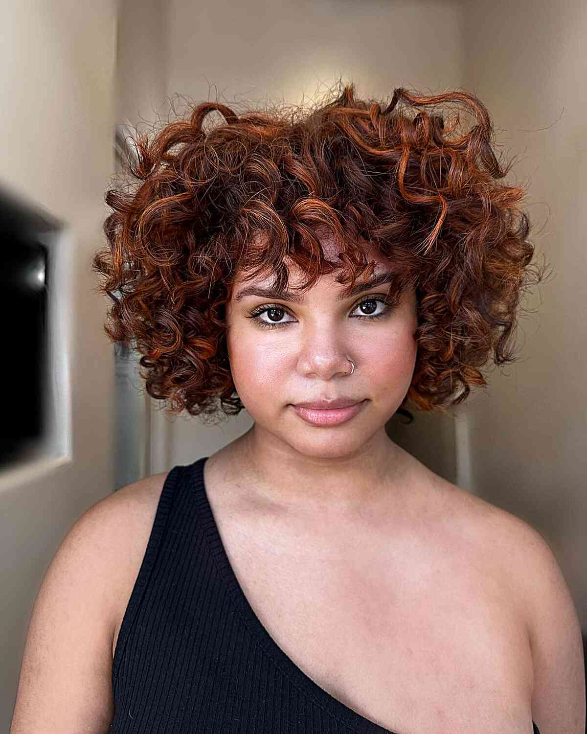 47 Best Short Curly Hair with Bangs to Try This Year