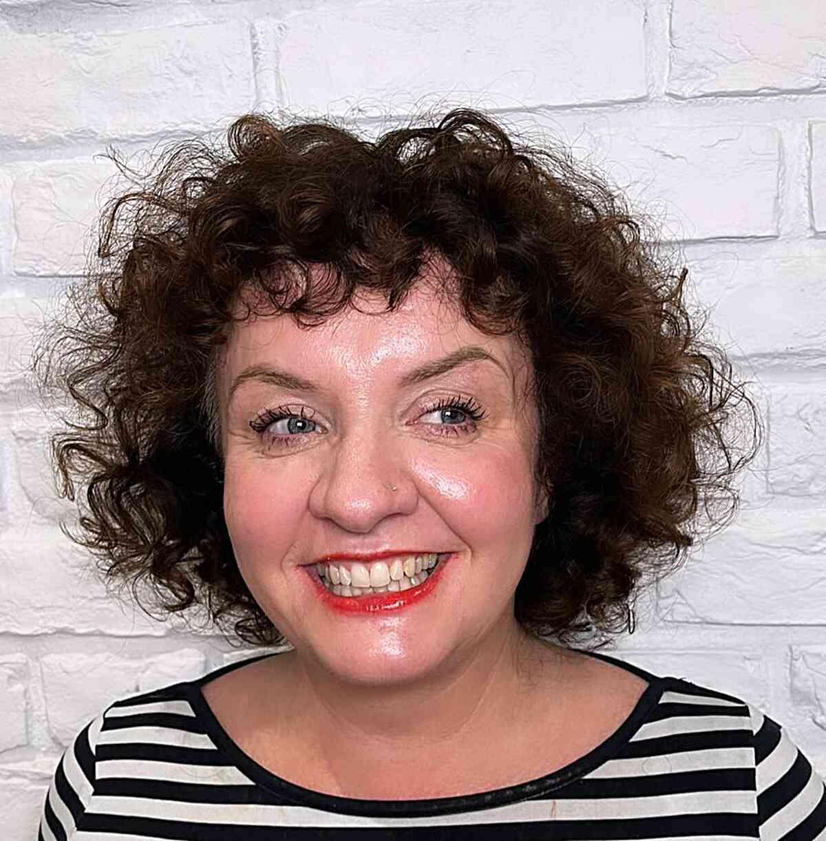 47 Best Short Curly Hair with Bangs to Try This Year