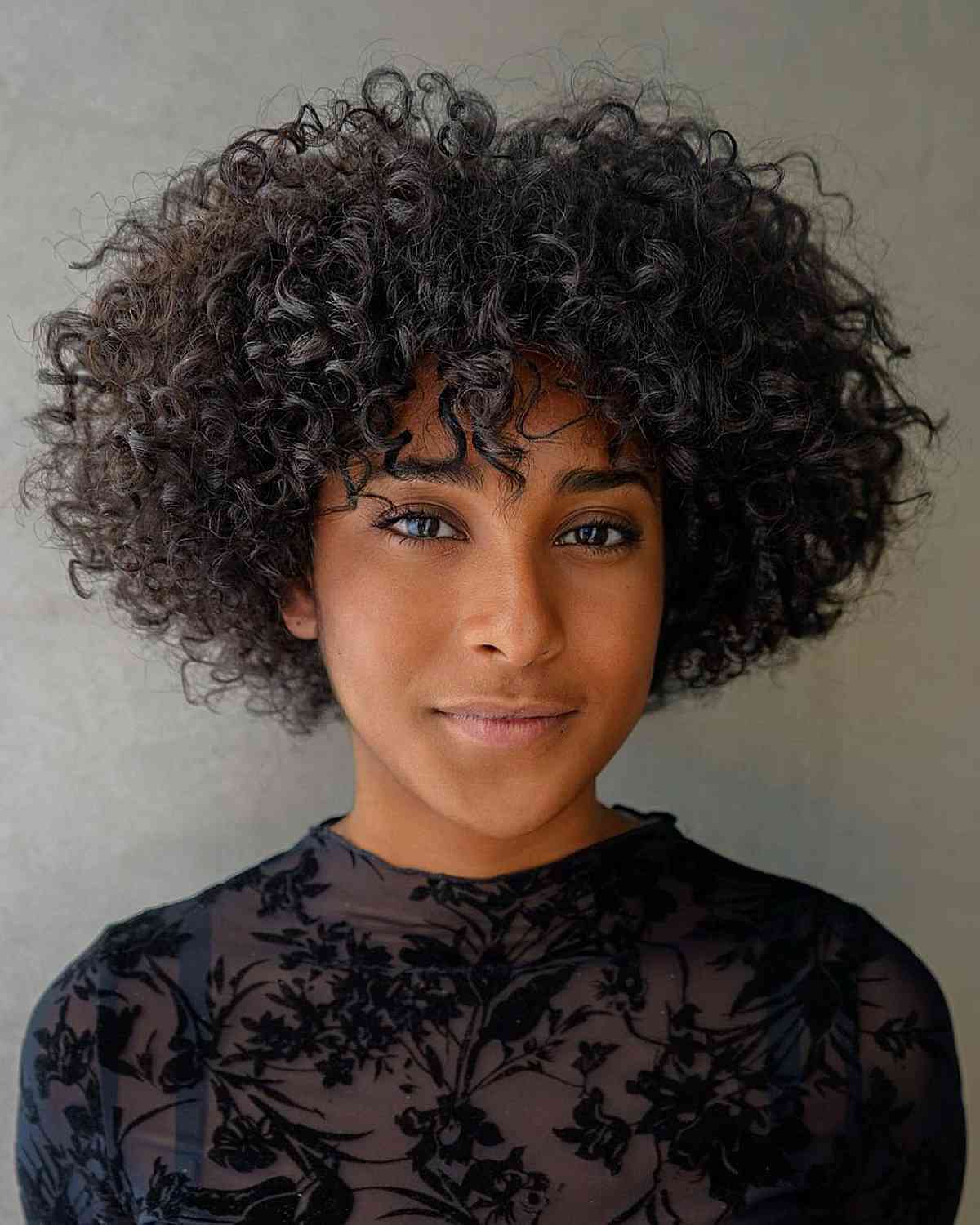 47 Best Short Curly Hair with Bangs to Try This Year