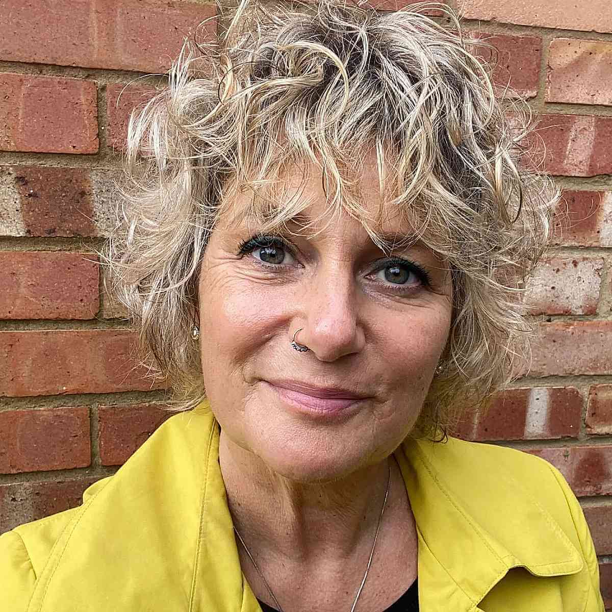47 Best Short Curly Hair with Bangs to Try This Year
