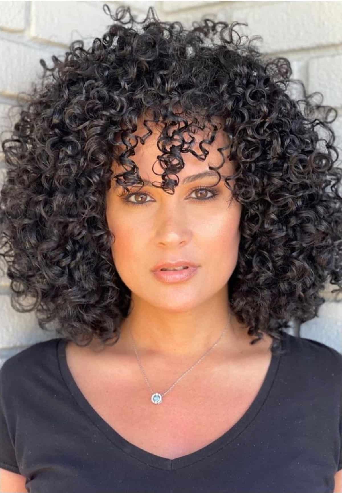 47 Best Short Curly Hair with Bangs to Try This Year