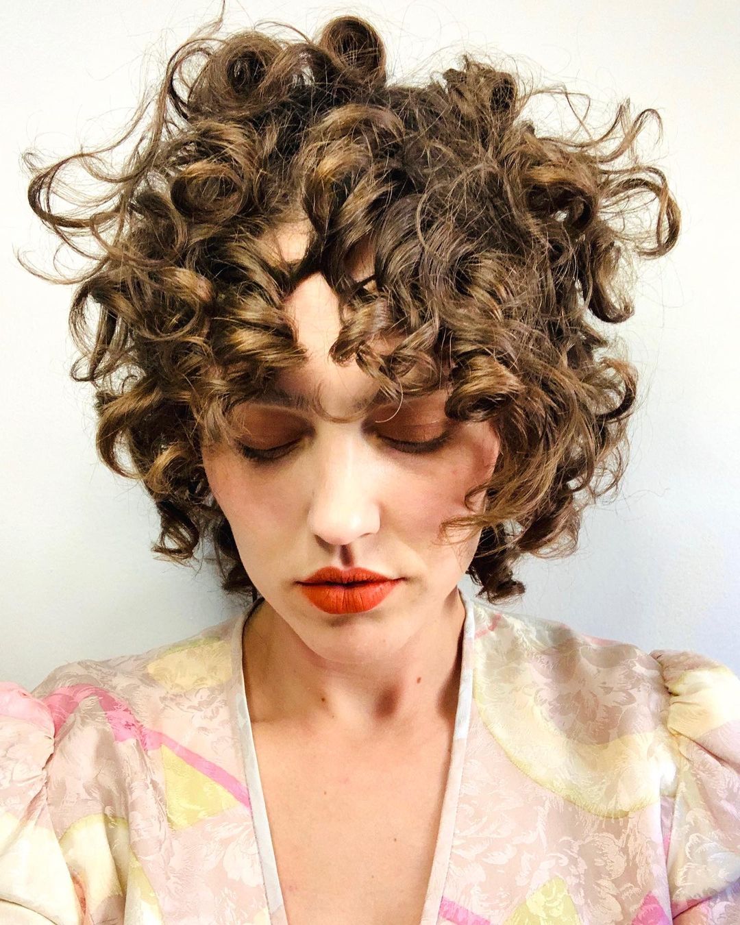 47 Best Short Curly Hair with Bangs to Try This Year