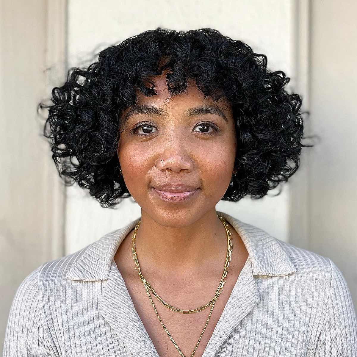 47 Best Short Curly Hair with Bangs to Try This Year