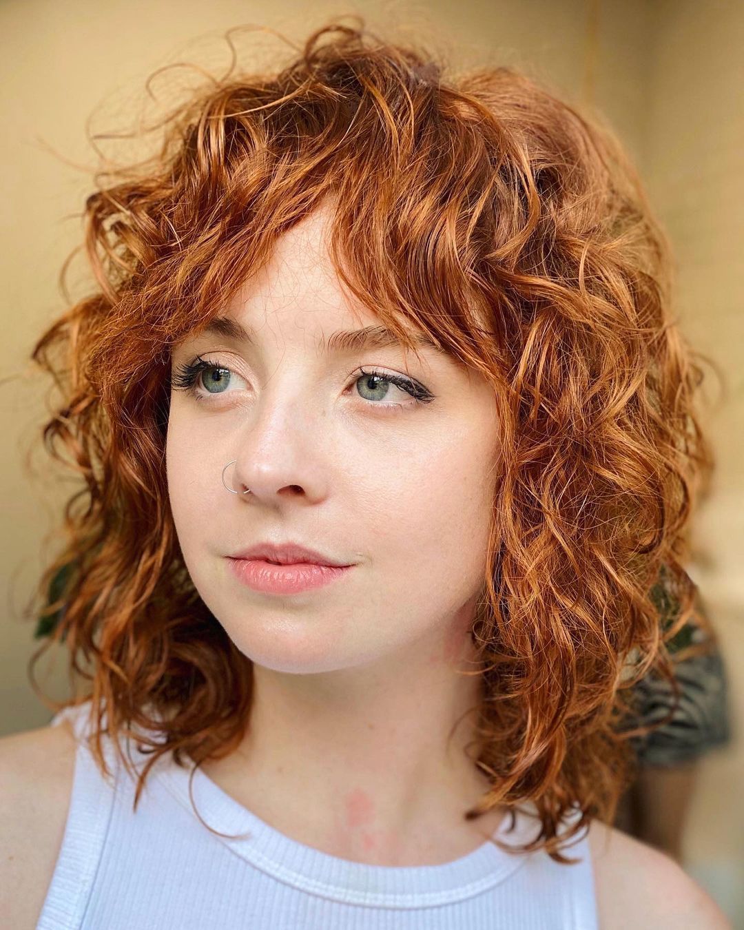 47 Best Short Curly Hair with Bangs to Try This Year
