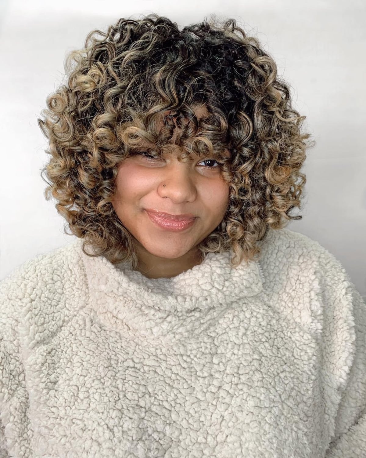 47 Best Short Curly Hair with Bangs to Try This Year