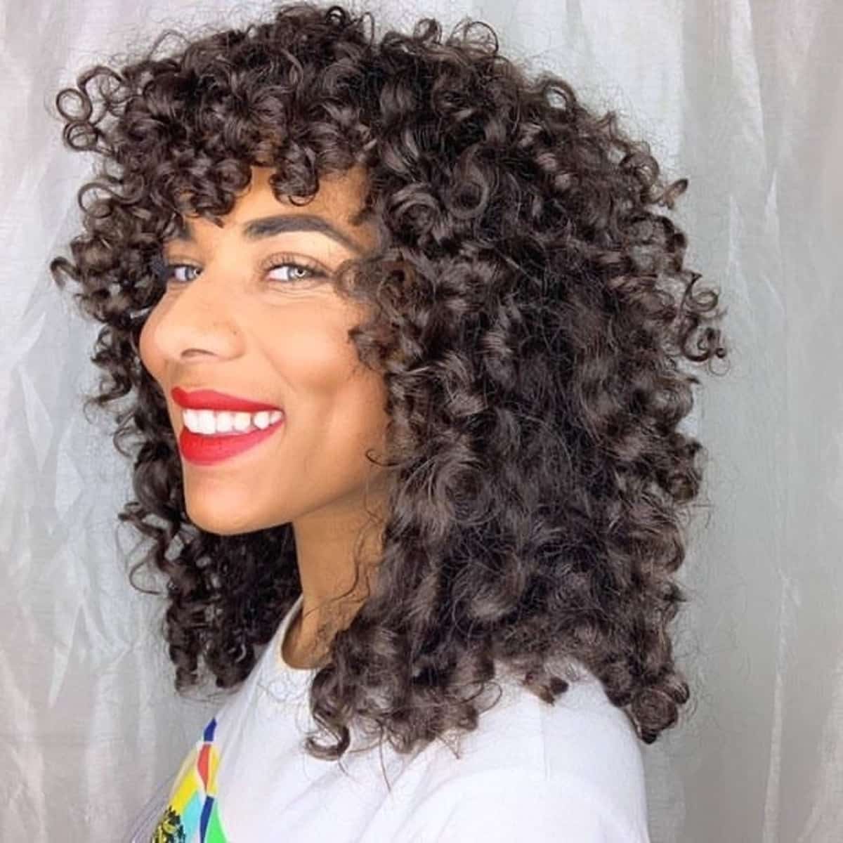 47 Best Short Curly Hair with Bangs to Try This Year
