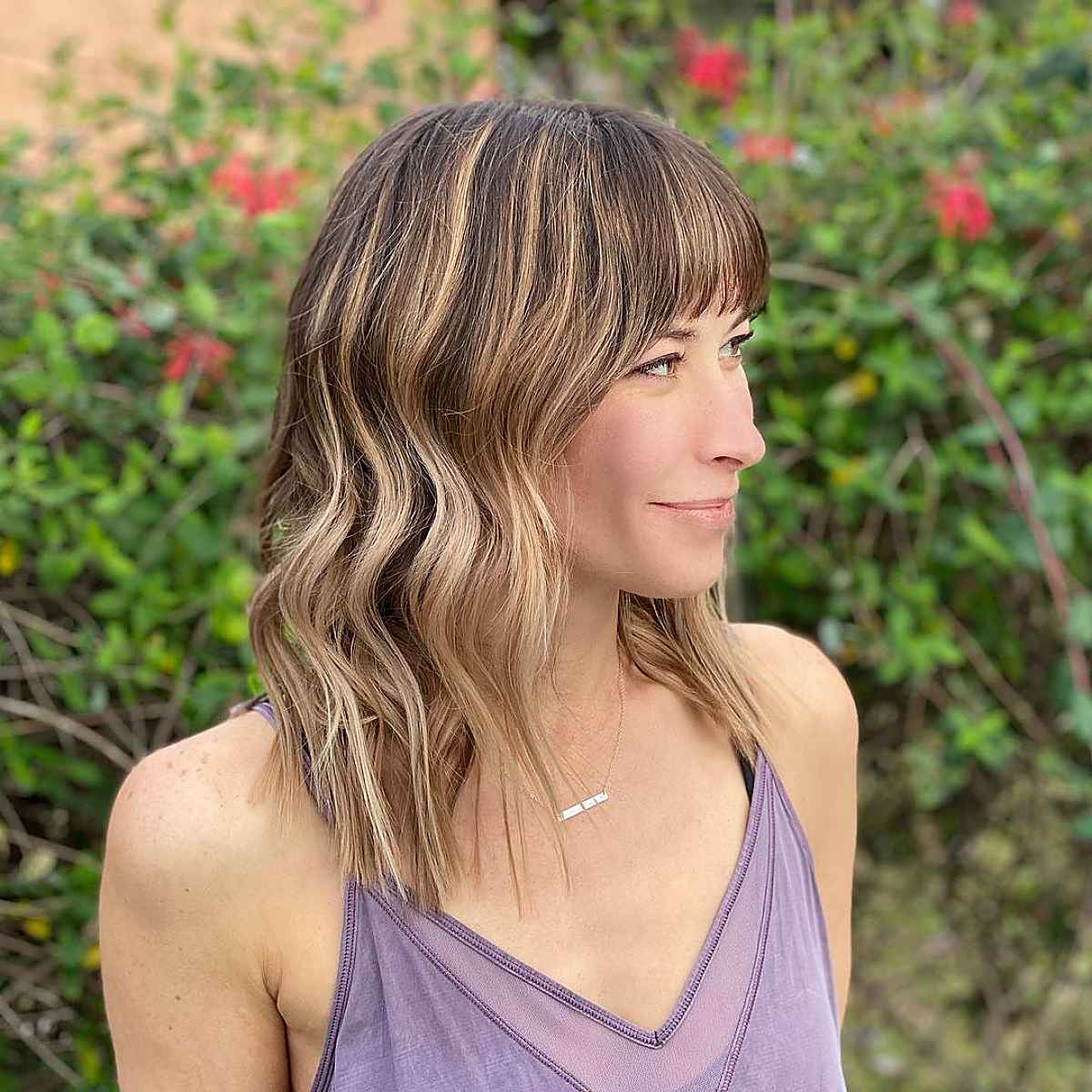 32 Ways to Pair Wavy Hair with Bangs for a Super-Flattering Look