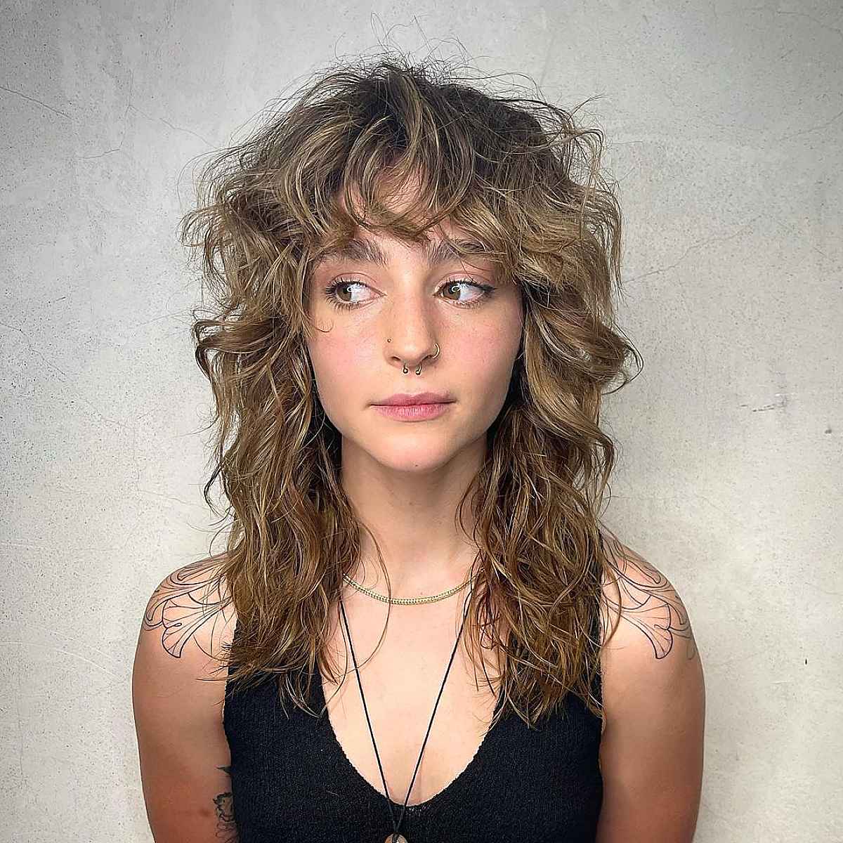 35 Greatest Ways to Pair a Wolf Cut with Bangs