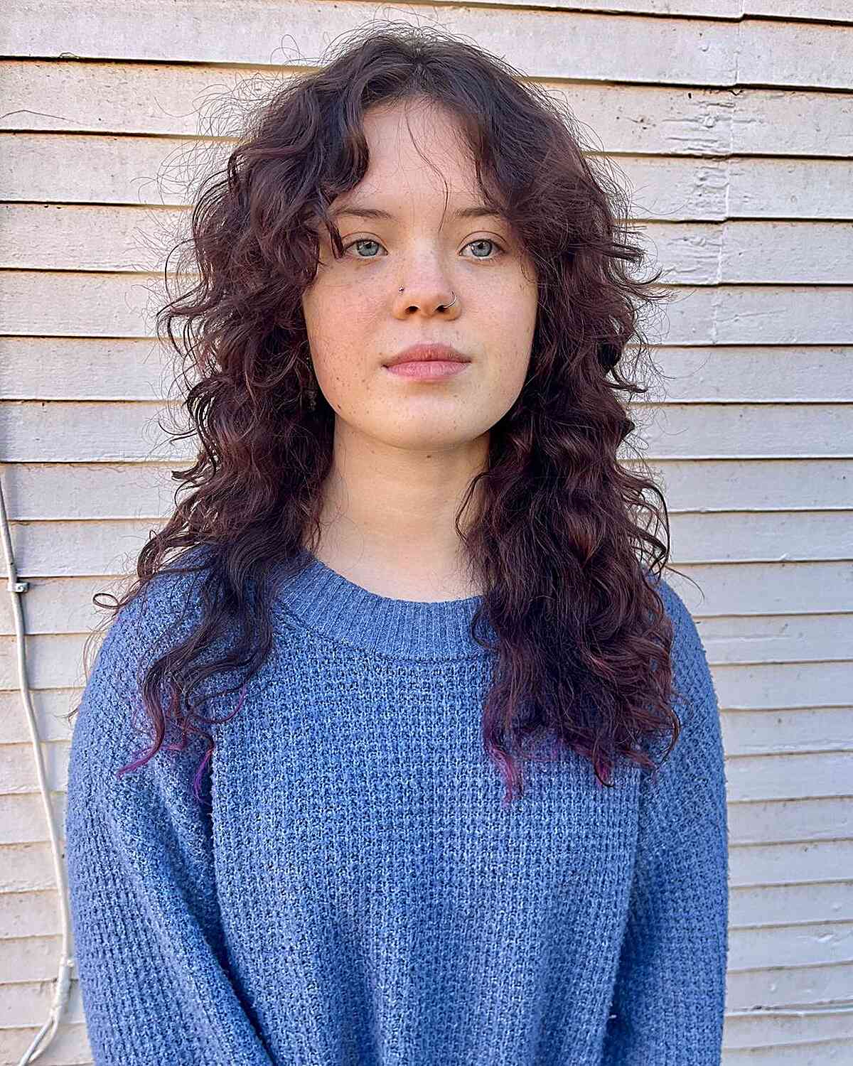 26 Best Ways to Get Curtain Bangs for Curly Hair Right Now