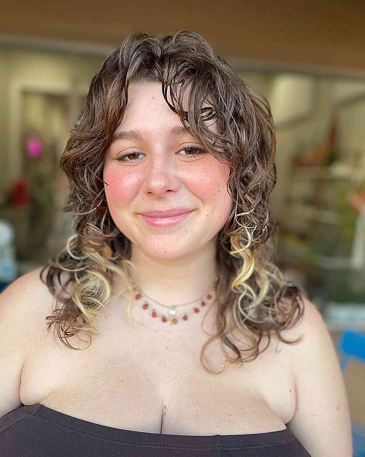 26 Best Ways to Get Curtain Bangs for Curly Hair Right Now
