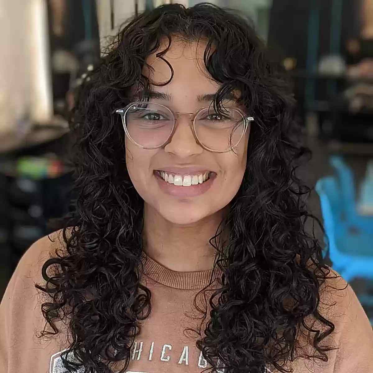 26 Best Ways to Get Curtain Bangs for Curly Hair Right Now