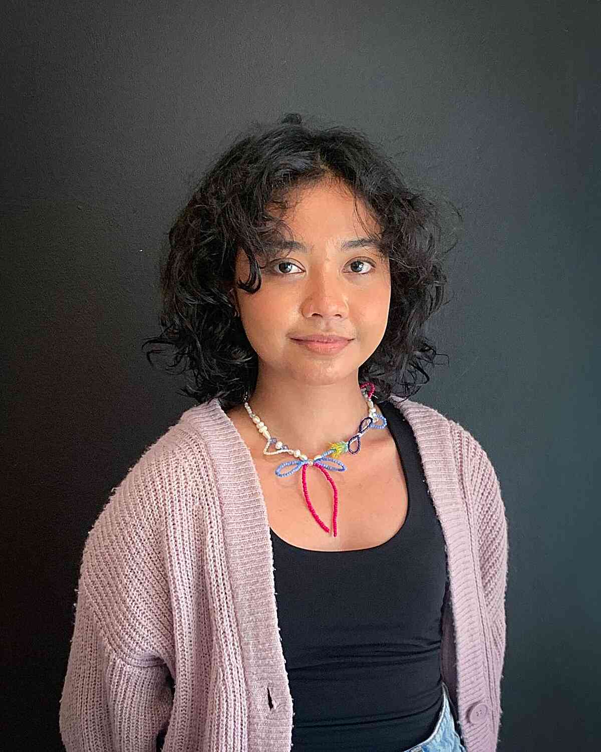 26 Best Ways to Get Curtain Bangs for Curly Hair Right Now