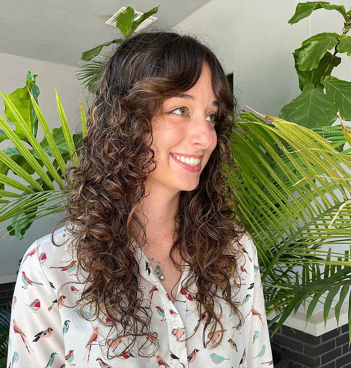 26 Best Ways to Get Curtain Bangs for Curly Hair Right Now