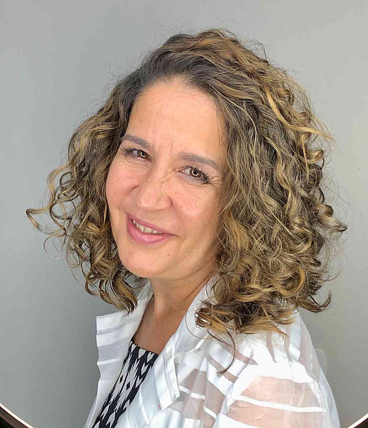 Curls That Wow: 27 Hairdos for Women Over 60 with Curly Hair